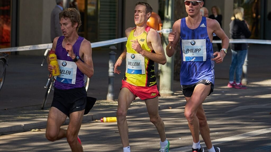 Marathon runners racing along a city street