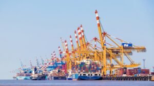 Gantry cranes loading containers at a deep-water port terminal